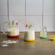 Load image into Gallery viewer, Pebbly Yellow Glass Measuring Jug with Silicone Base - 500 ml