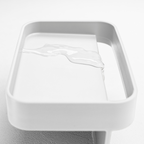 Blim+ Battigia Sponge Holder in white, close-up of the tray with water on it