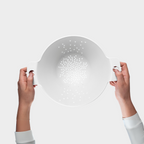 Blim+ Cosmo Colander Medium in white, held up in both hands, seen from the front
