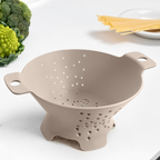 Blim+ Cosmo Colander Medium in taupe, on a kitchen counter