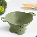 Blim+ Cosmo Colander Medium in green, on a kitchen counter