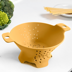 Blim+ Cosmo Colander Medium in yellow, on a kitchen counter