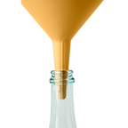 Blim+ Dolina Funnel in yellow, placed in a glass bottle