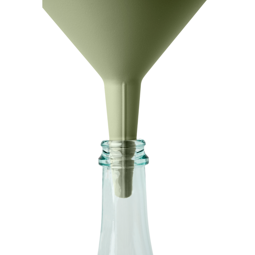 Blim+ Dolina Funnel in green, placed in a glass bottle