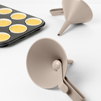 Blim+ Dolina Funnel in taupe, beside a muffin tray