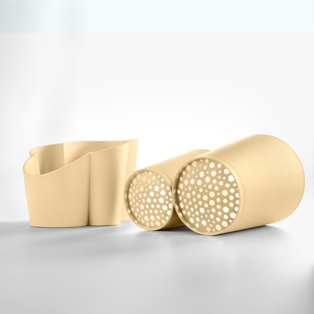 Blim+ Gocciolo Cutlery Drainer in pale yellow, with the two parts shown side by side