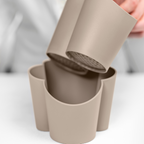 Blim+ Gocciolo Cutlery Drainer in taupe, with the top part being lifted by hand