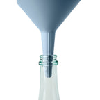 Blim+ Dolina Funnel in blue, placed in a glass bottle