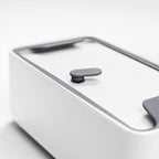 Blim+ Lunchbox Bauletto Small in white, close-up of the lid and handle
