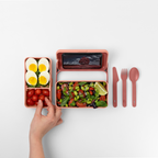 Blim+ Lunchbox Bauletto Small in pink, open with salad, boiled eggs and cutlery