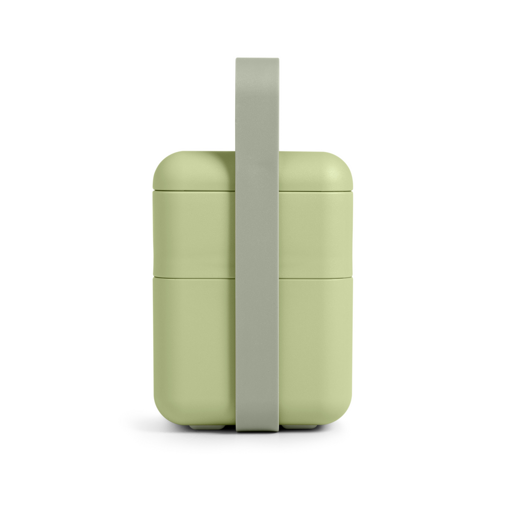 Blim+ Lunchbox Bauletto Medium in green with the handle raised, front view