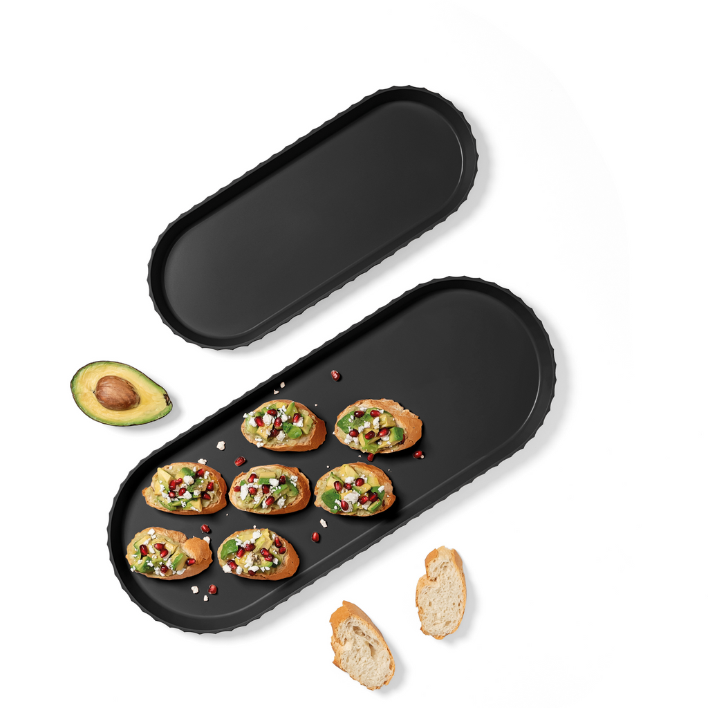 Blim+ Minerva Tray Medium in black, oval tray with canapés and avocado