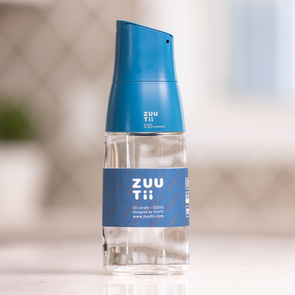 Zuutii Oil Dispenser in blue, front view on a kitchen counter