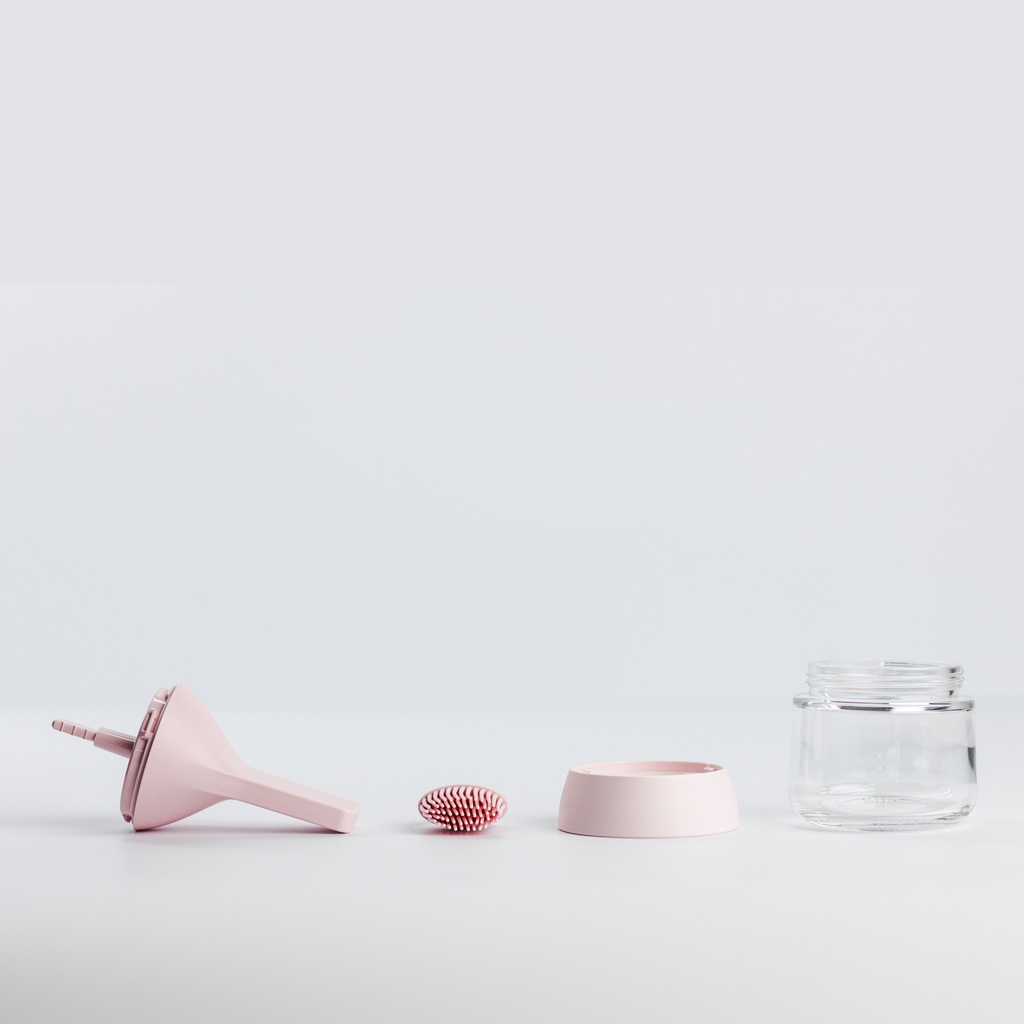 Zuutii Oil Dispenser with Brush in pink, separated into brush, lid, ring and glass jar