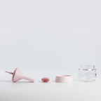 Zuutii Oil Dispenser with Brush in pink, separated into brush, lid, ring and glass jar