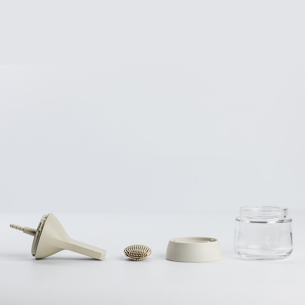 Zuutii Oil Dispenser with Brush in cream, separated into brush, lid, ring and glass jar