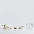 Zuutii Oil Dispenser with Brush in cream, separated into brush, lid, ring and glass jar