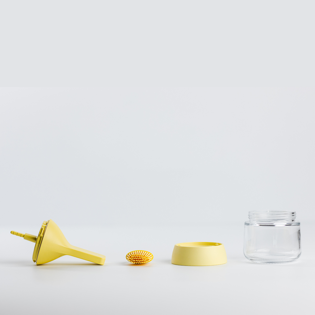 Zuutii Oil Dispenser with Brush in yellow, separated into brush, lid, ring and glass jar