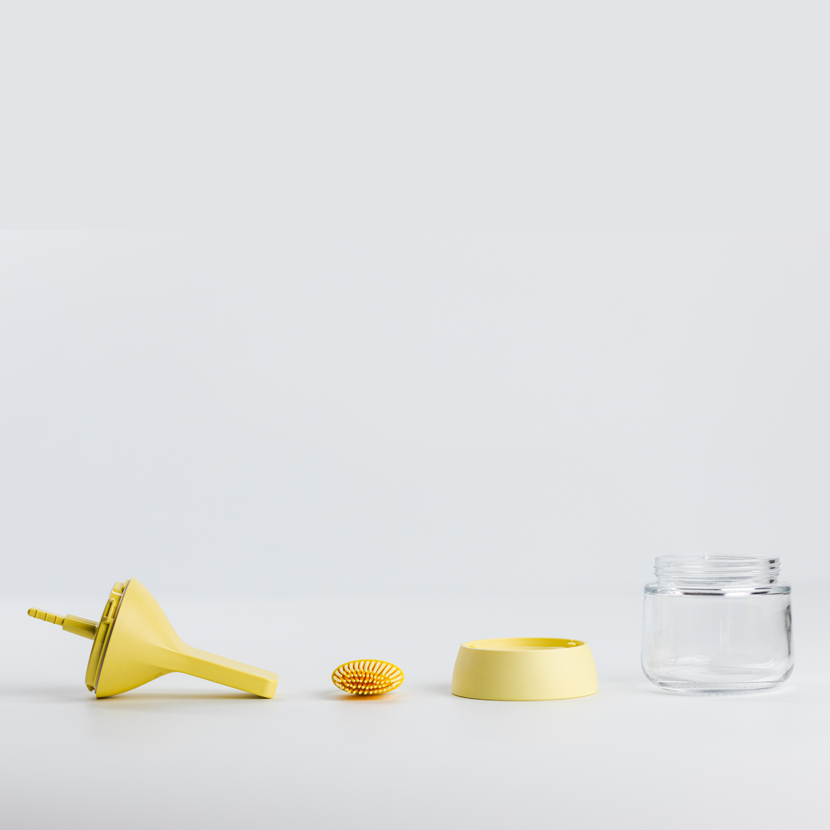 Zuutii Oil Dispenser with Brush in yellow, separated into brush, lid, ring and glass jar
