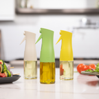 Zuutii Oil Sprayer in cream, green and yellow on a kitchen counter