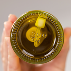 Zuutii Oil Sprayer in yellow seen from below, showing the glass base