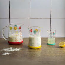 Load image into Gallery viewer, Pebbly Yellow Glass Measuring Jug with Silicone Base - 500 ml
