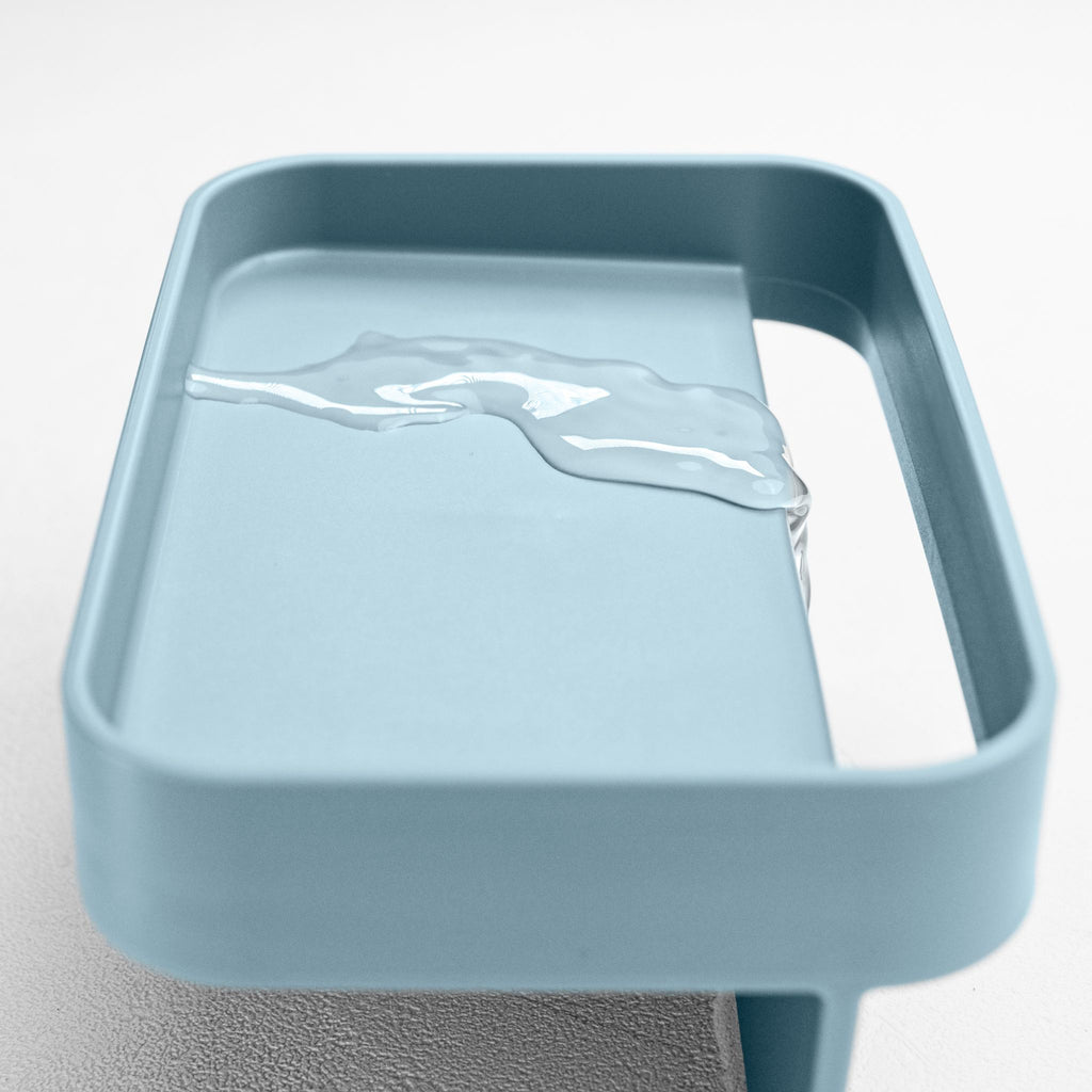 Blim+ Battigia Sponge Holder in blue, close-up of the tray with water on it