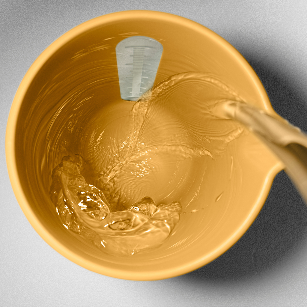 Blim+ QB Carafe in yellow, seen from above with water being poured in