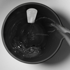 Blim+ QB Carafe in black, seen from above with water being poured in