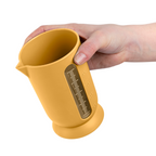 Blim+ QB Carafe Small in yellow, held in a hand