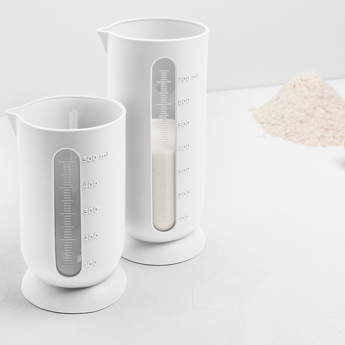 Blim+ QB Carafe Small and Medium in white, side by side with flour measured in