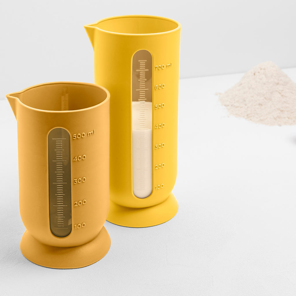 Blim+ QB Carafe Small and Medium in yellow, side by side with flour measured in