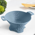 Blim+ Cosmo Colander Medium in blue, on a kitchen counter