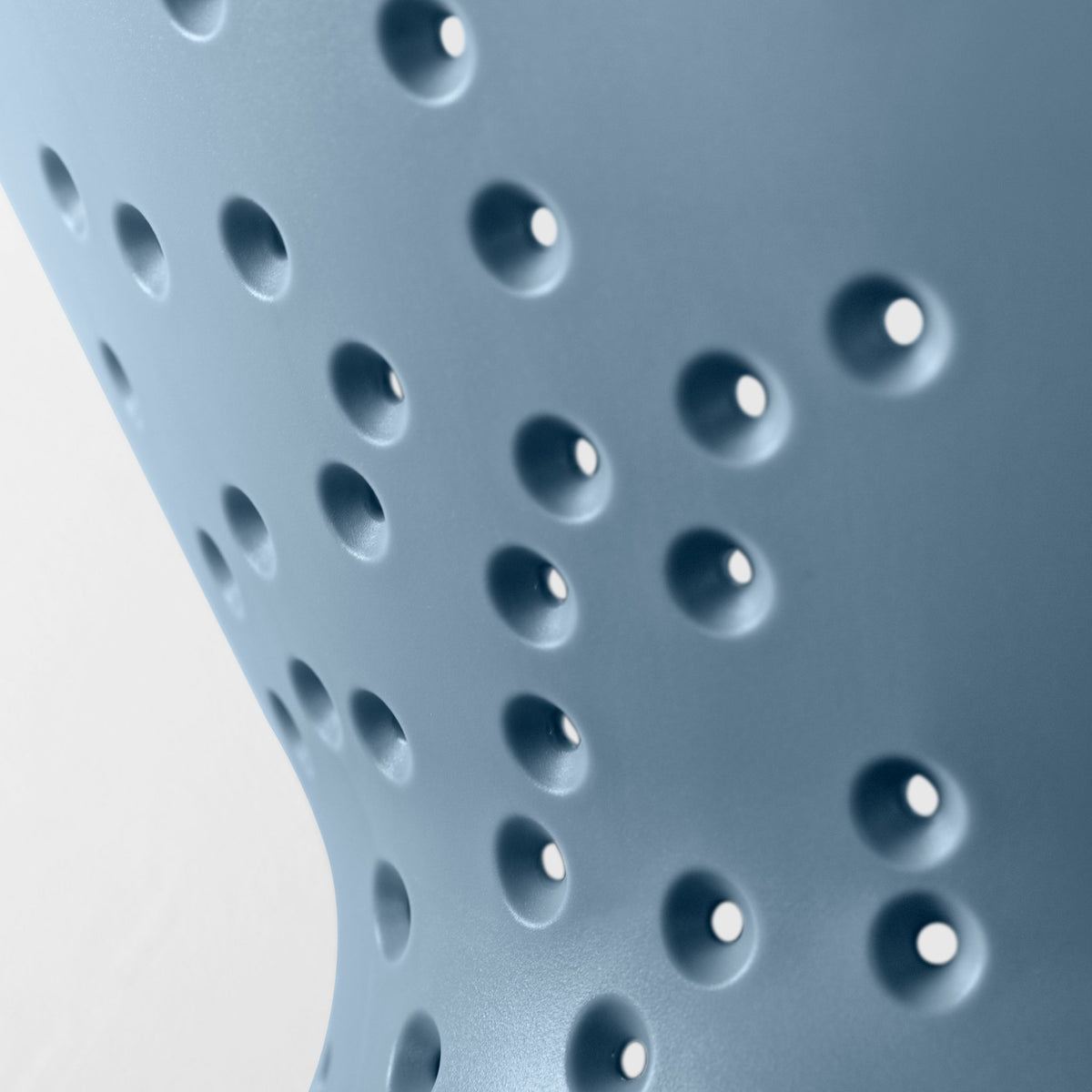 Blim+ Cosmo Colander Medium in blue, close-up of the drainage holes