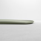 Blim+ Skateboard Chopping Board Medium in green, side view showing the thin profile
