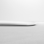 Blim+ Skateboard Chopping Board Medium in white, side view showing the thin profile