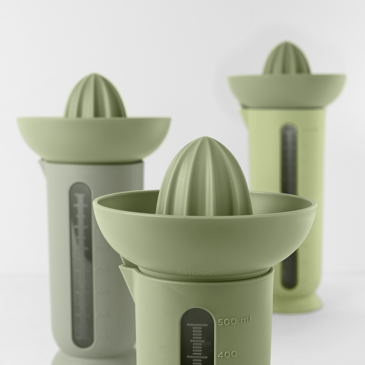 Blim+ UFO Juicer with QB Carafe in green, with juicer and carafes in different sizes